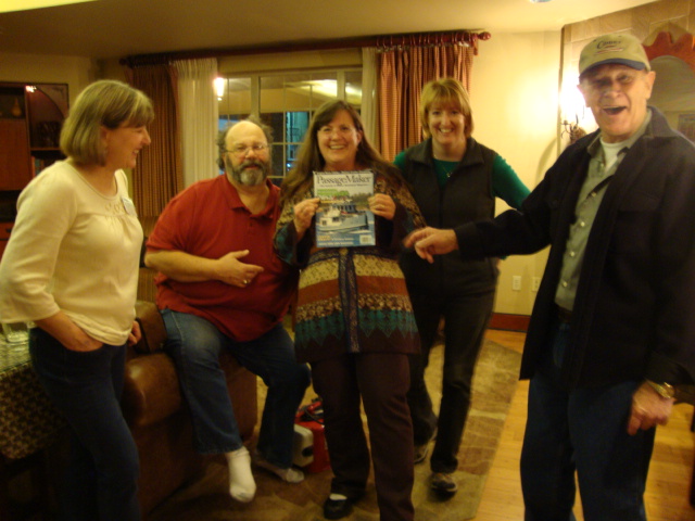 Susan shows a photo of her
next boat to Cathy, Jim,
Amy & Joe