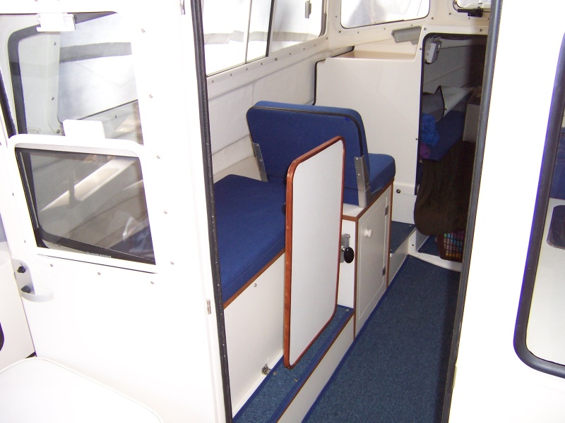 Table can also be stowed in a vertical position allowing one person to sit on bench seat. Access to storage lockers is possible in this position also.