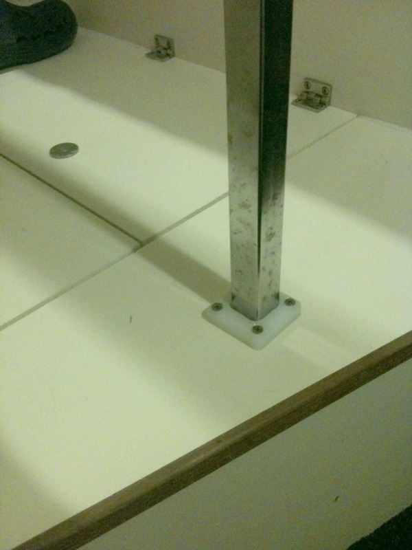 Table leg support (keeps leg from getting pushed out of factory support hole).