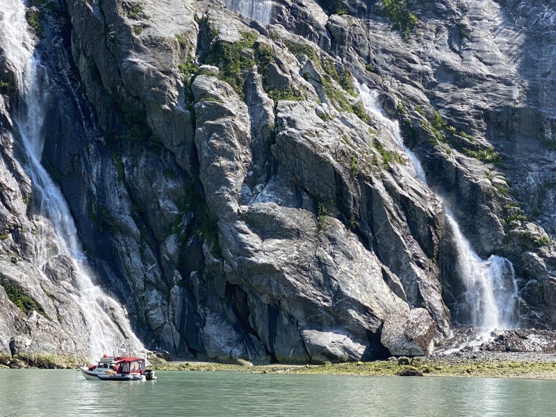 Taking Maggie to shore by North Sawyer glacier waterfalls