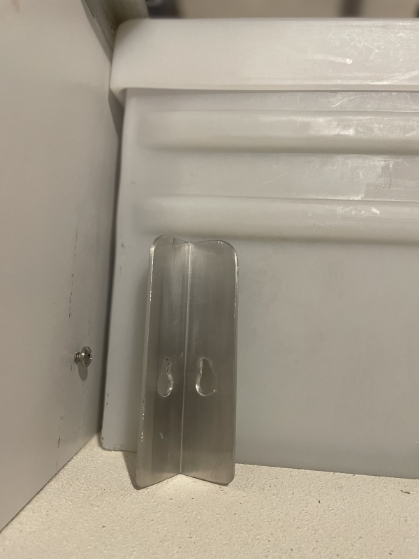 the aluminum angle brackets slide on and off bolts had nylock nuts and washers on the inside of the drawer sliders