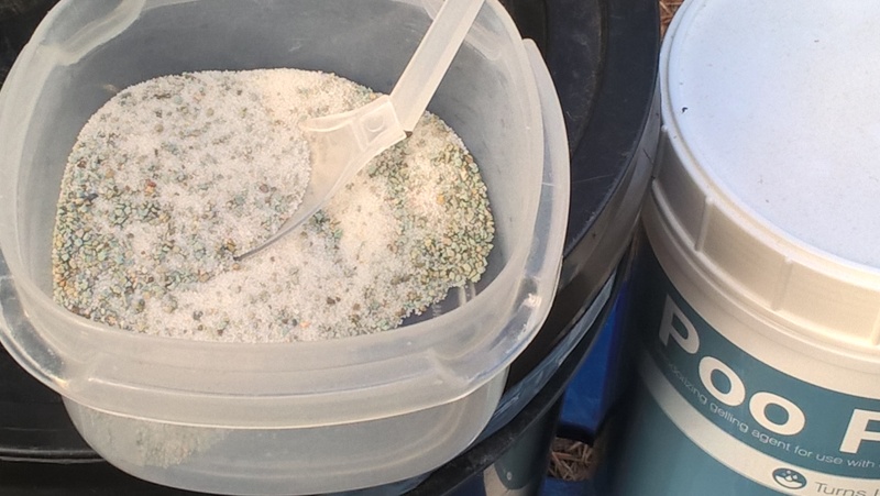 The bag has "Poo Powder" in it.  Amazing stuff.  I bought the large size, not realizing that it is a lifetime supply.  I just take the little container with me for two week trips.