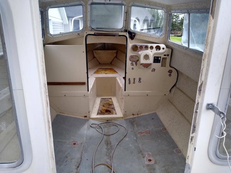 The cabin is stripped, all fasteners removed and holes enlarged. All holes filled with thickened Epoxy prior to paint. Core looked great in the cabin,