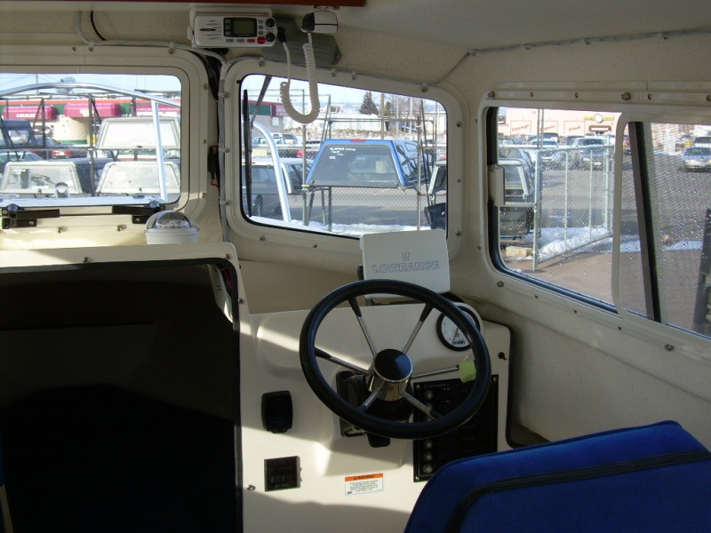The electronics consist of a Lowrance LMS-520C Sonar/GPS Chartplotter Combo, and a Uniden Oceanus VHF. Dave Miller at Northwest Outlet didn't like the position of the "standard" wheel, and upgraded me to the tilt wheel option.