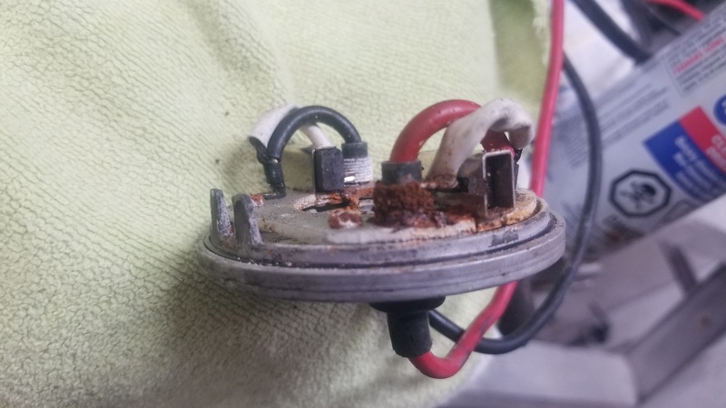The end bell of a Lewmar V700 windlass showing corrosion of the motor brush springs