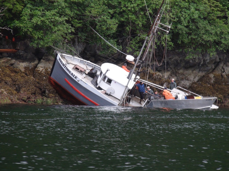 The fishing boat "Nightengale" on the rocks