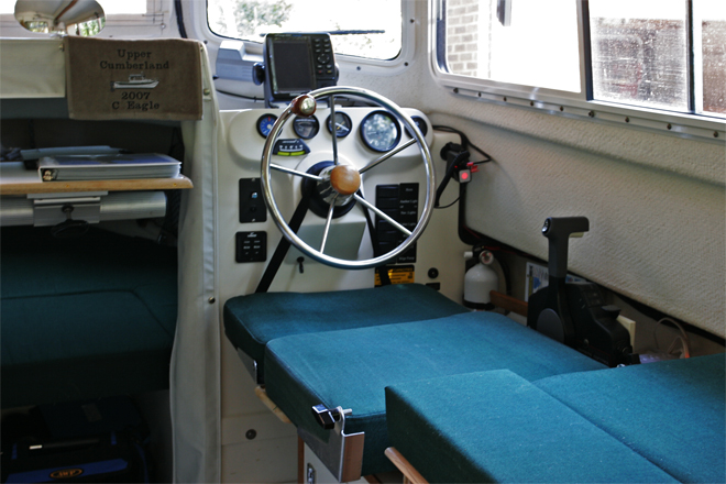 The helm seatback is quickly removed with a large knob on each side, I drilled out the aluminum rivets and used a tee nut (with brad holes) to accept the 5/16-18 bolt. The teenut is held in place with JB weld.