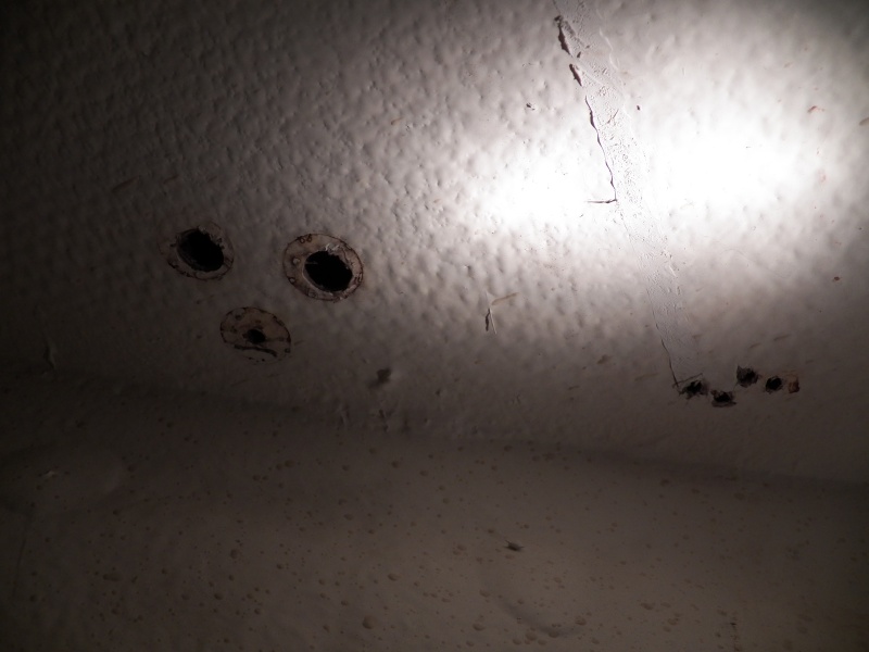The next balsa core issue was the foredeck.  This is the worst of the bow pulpit mounts looking from inside, looking up from the V berth.  I could tell that there had been moisture on the through bolts, but I thought that it was from condensation on the inside.  That could be part of it, but there was also wet balsa surrounding these fastenings.  I bored them out from the inside to check for moisture, allowed the deck to dry out, and provided an epoxy core when refastening.