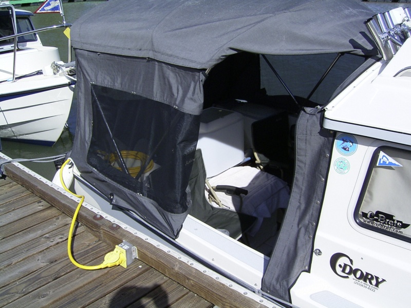 The side panel folds back and the top folds under for easy access at the dock. Both sides are the same.