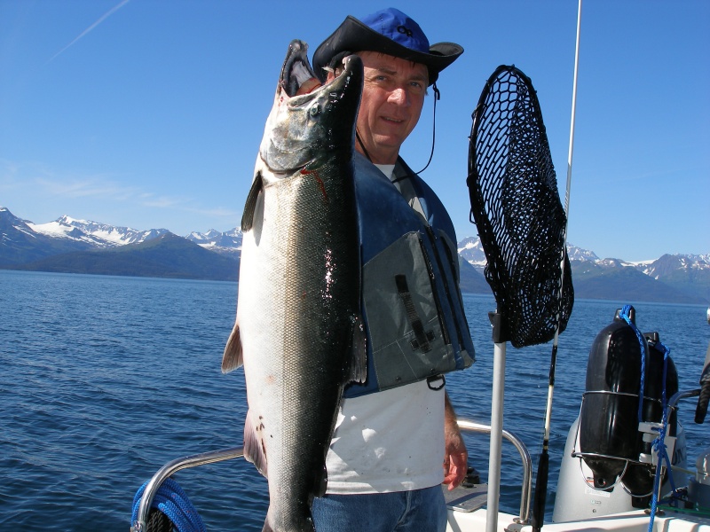 The trick is to hold the fish way out in front of you toward the camera.  They look much bigger that way.