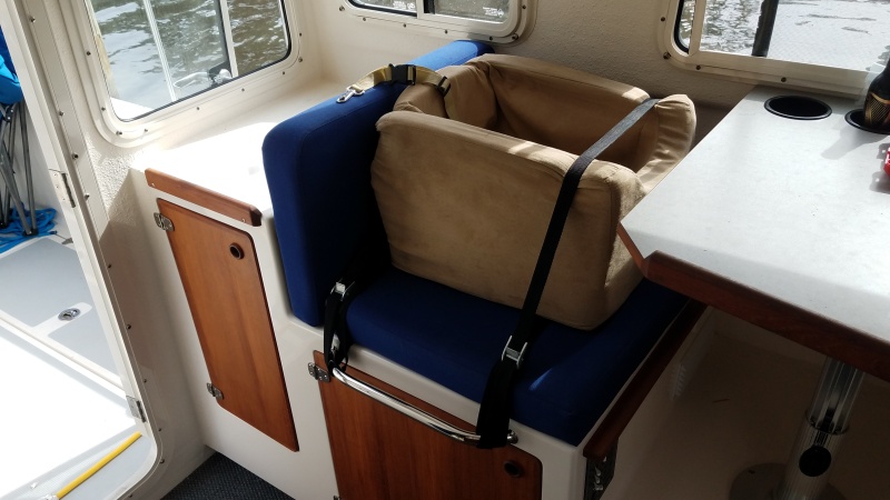 The whole kneeling bar/cargo strap idea was originally because of the dog.
Necessity is the mother of invention, and the little pup couldn't travel without her favorite dog bed.
Creative ways to secure a carseat/dogseat in a vehicle with no seat belts.