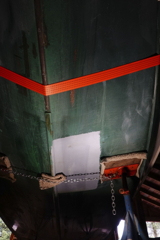 There was a painted section on the bottom of the hull that appeared "flat" - meaning it didn't follow the contour of the surrounding fiberglass. It just looked like a shoddy repair to me and I couldn't live with that.