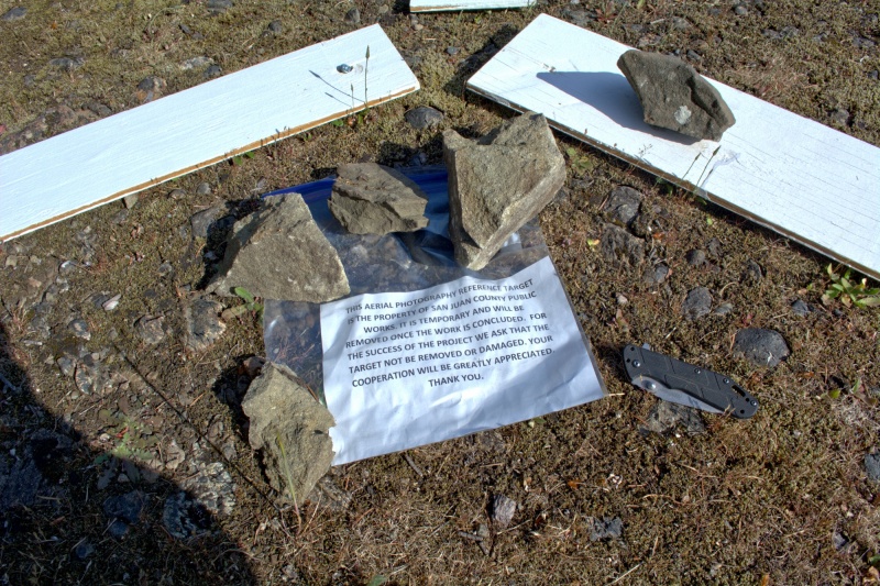 There was this little triangular "target" on the hill above Reid Harbor, with a note and a forgotten pocket knive. I tucked the knife under the note for safe keeping, hopefully the owner found it.