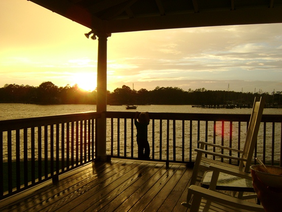 Thessaly watching sunset from Whittaker Point Marina clubhouse.