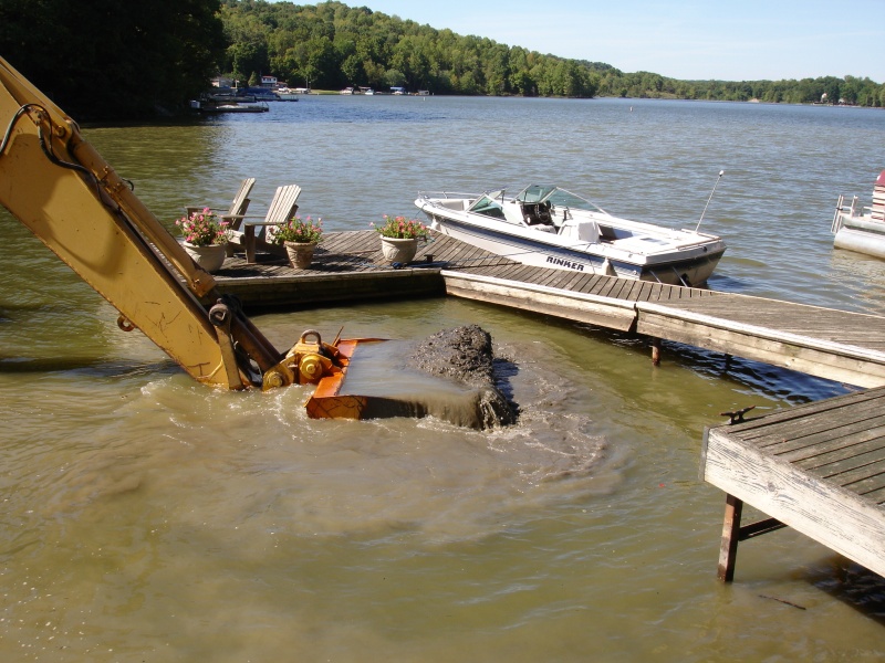 This about the only pic I can find of my "beater" a 1988 Rinker.  We call it the Dog Boat.  We had a bit of dredging in 2007.