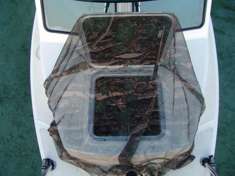 This is a bug net that I made. A simple fabric screen with a galvanized chain sewn in the border to keep it down