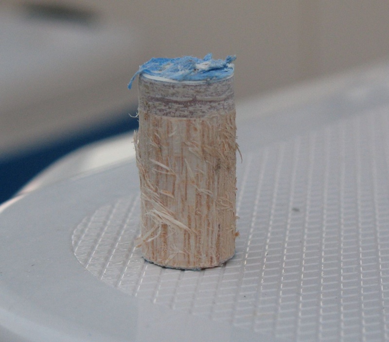 This is a "core sample" of the transom from where I overdrilled the holes for mounting the Mini Jacker.  At the top is the outer skin.  The reason there is no inner skin on the sample is that I just cut the large hole up to the inner skin but not through it.  I only made a fastener-sized (smaller) hole through the inner skin, so it's not attached to the core sample.