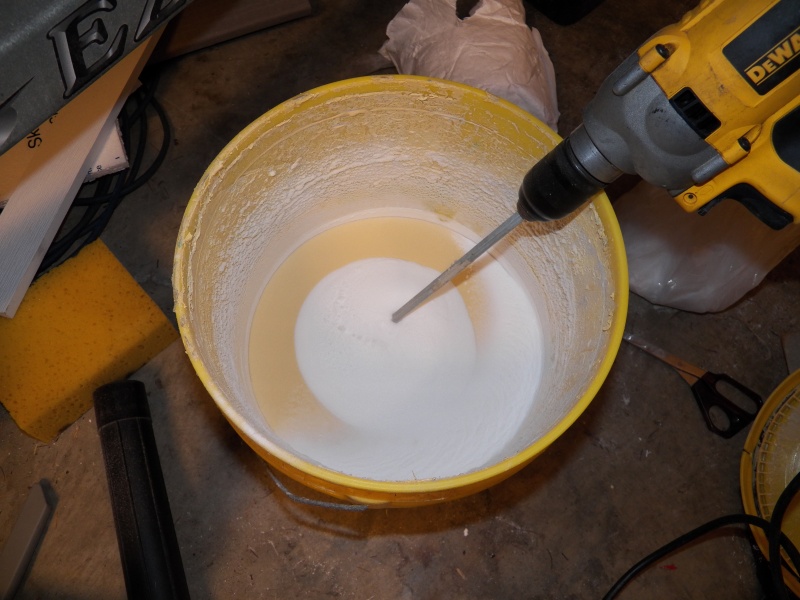 This is my home-brew insulating paint.  It is some leftover latex water proofing paint used on concrete block prior to applying a stucco finish.  It dries thick and to a consistency about like a pencil eraser.  I'm adding micro balloons to it (the secret ingredient).