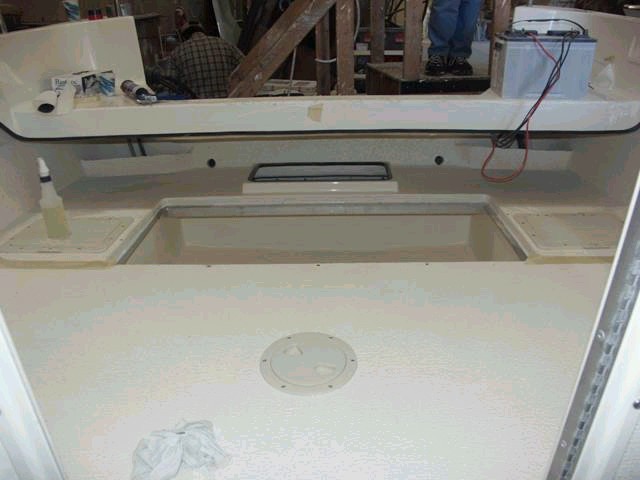 This view shows the depth (rearward of the fish box.  The fish box lid access was limited by the open access area directly behind which is needed to install the engine bolts (lower) and to service the bilge pump.