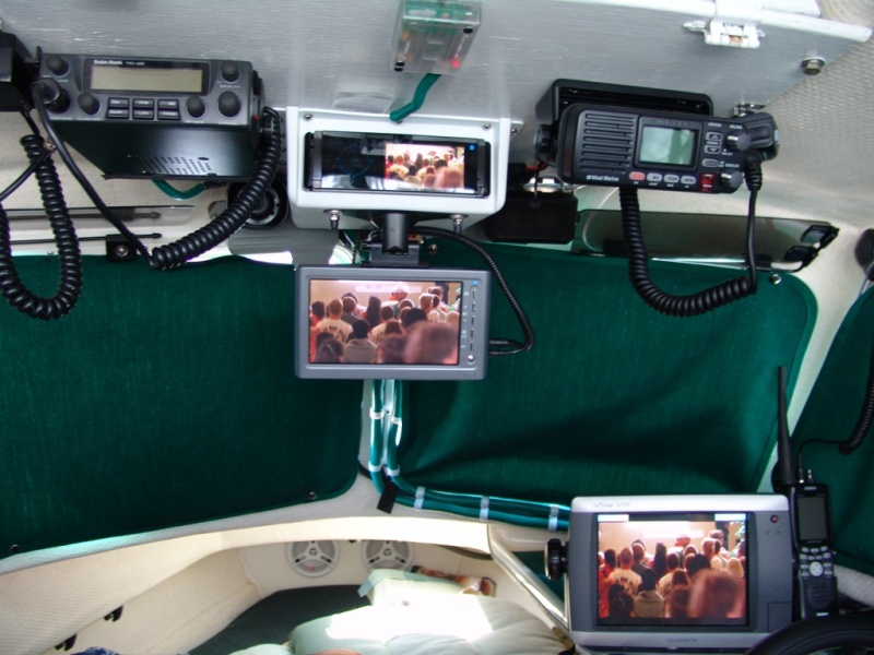 Top center is a JVC CD/DVD/HD Radio with 3.5", below is a 7" monitor, on the dash is the Garmin 5208. Left of center is a Radio Shack CB and to the right is a West Marine DSC/VHF. To the right of the Garmin is a Uniden hand held GPS/VHF backup. Very top center is sensor for alarm system.