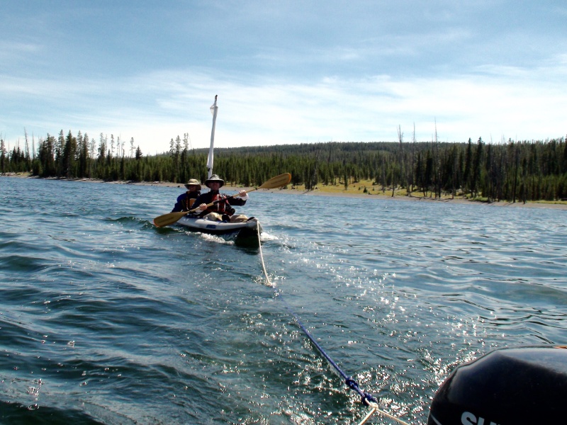 Towing Kevin & Laura of \"Montana Kev\" CD22 Grace on their Sea Eagle kayak back up Yellowstone Lake with our Kaboat