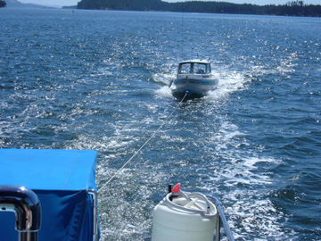 Tows a little "Bow-low". Needs a lower bow eye. Any speed faster than 7 knots, the bow goes down and she gets squirrelly