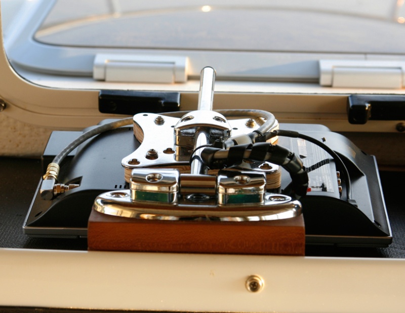 TV-Stowed-Flat-Face-Down: TV stows flat in a protected position on a rubber mat. When underway, I place the front window cover on top of the tv for anti splash protection in rough water.