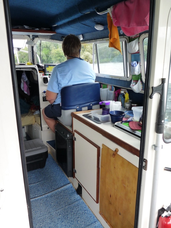 Two Bears in travel mode, Penny at helm.  Note that we have removed right hand cabnet door and replace with a 1/4 inch piece of plywood.  See next photo for the change to "living mode".