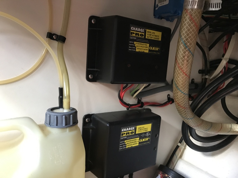 Two Guest dual battery chargers in galley counter cabinet.