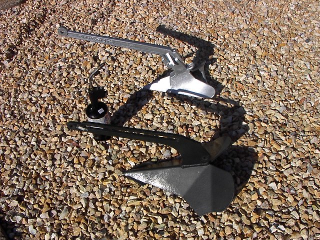 Two New Anchors to Try Out: 15 lb CQR look-alike & 20 lb plow \"Black Max\" from Cleveland Anchor Co.   Propane torch for size comparison.