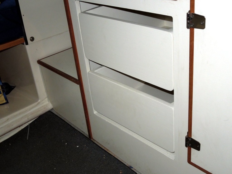 Used a good latex satin match tinted to surface of cabin plywood finish.