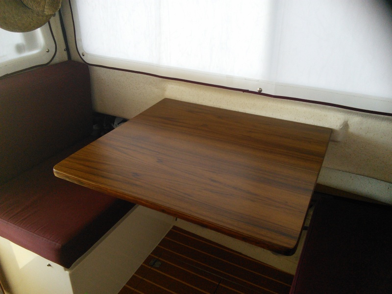 Used the original dinette table and simply covered it with veneer.  Then applied 6 coats of marine varnish.