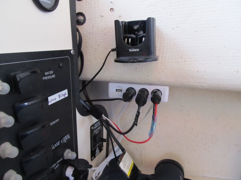 VHF charging cradle and 12v accessory sockets next to the helm.  There is one over on the co-pilot side as well.