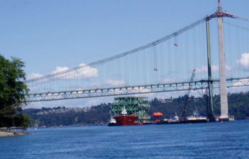 Weight lifting test on winches used to lift road deck from ship.The orange bags are full of water and weigh a total of over 500 tons.