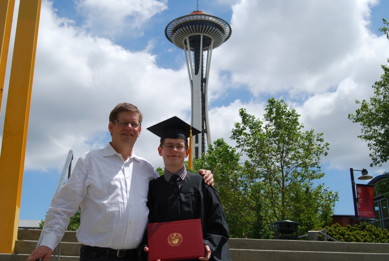 With his proud father.