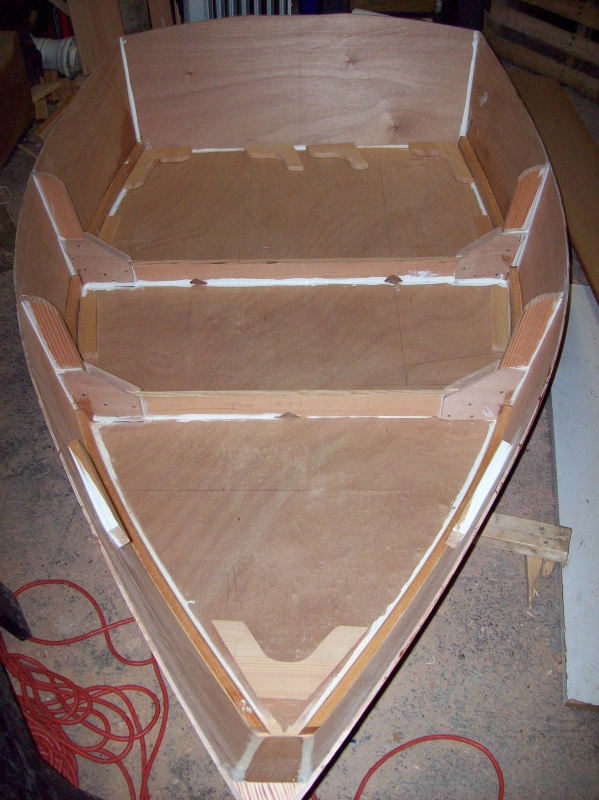 You can see laying on the floor of the dinghy I have cut the breast hook, remaining seat risers, transom knees, and quarter knees (but not yet installed).  These items require a lot of patience with careful sanding to get everything to fit snug.